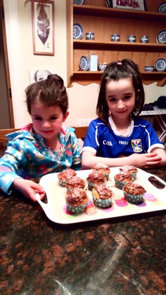 Chloe and Sarah in blue, making buns for autism awareness day. 