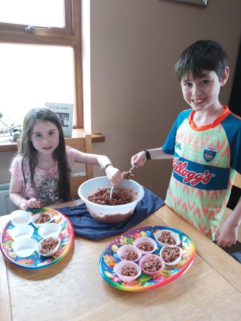 Lauren and James making rice krispies buns.