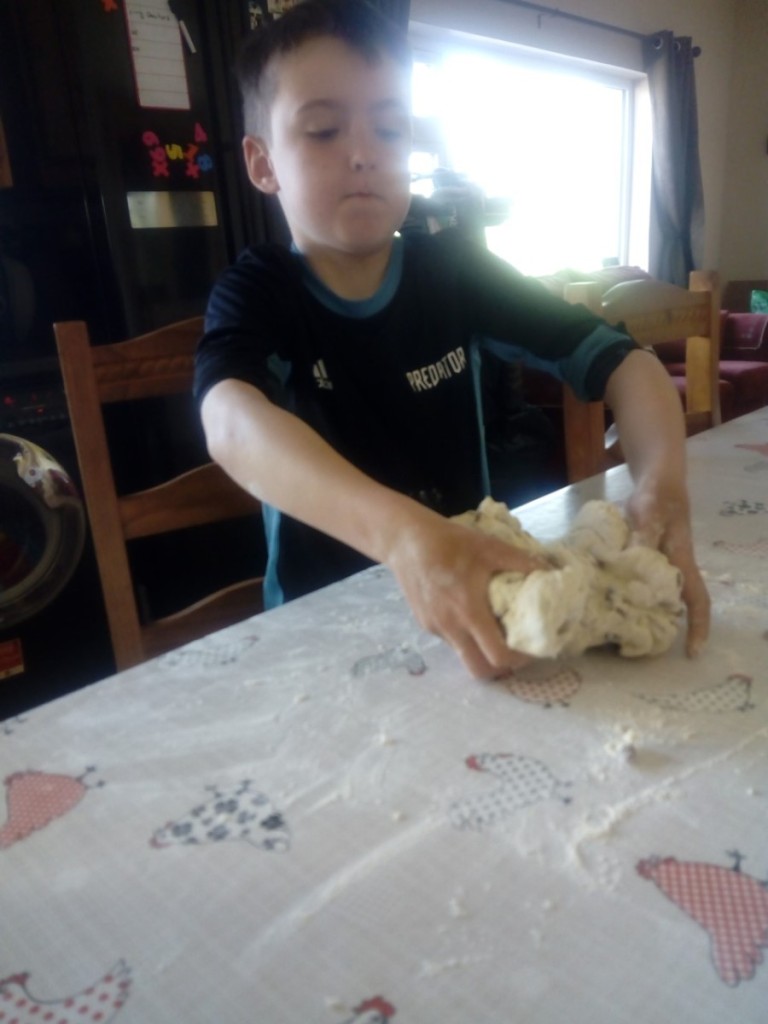 Tomás making homemade bread